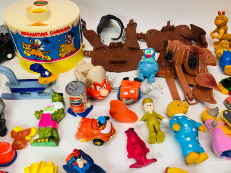 Photo 3 of 278277…vintage toys, happy meal, wind up, and others. Dreamtime carousel needs disc- not complete 