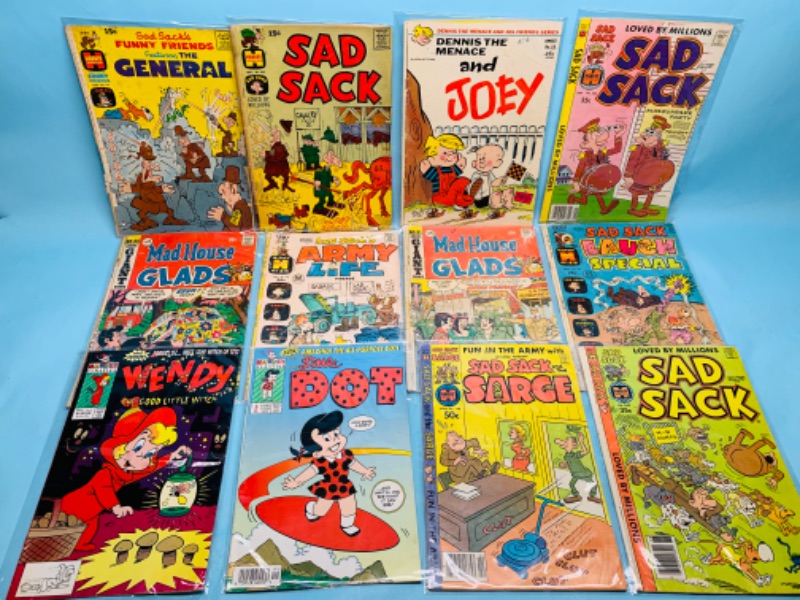 Photo 1 of 278318…12 vintage comics in sleeves- show wear from age 