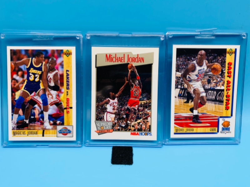 Photo 1 of 278337…3 Michael Jordan trading cards in hard plastic sleeves