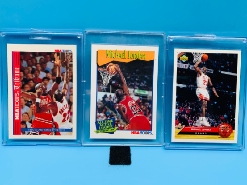 Photo 1 of 278339…3 Michael Jordan trading cards in hard plastic sleeves