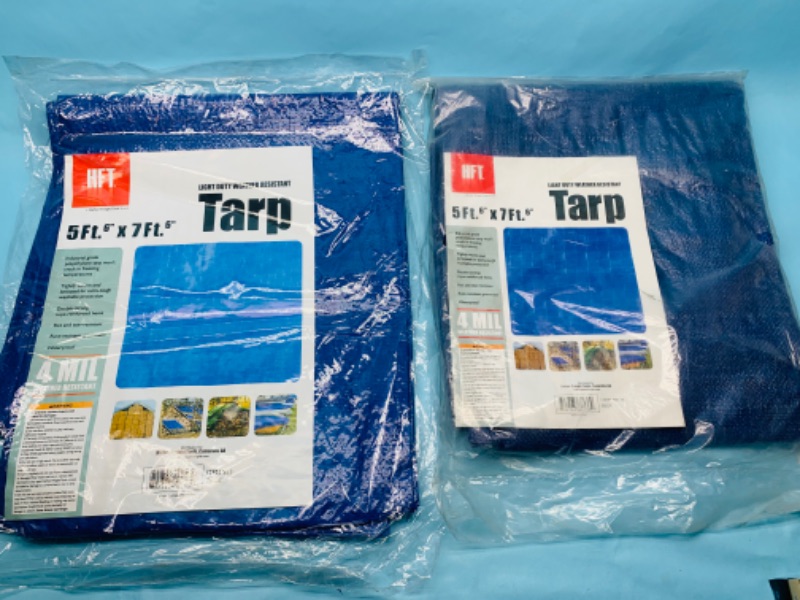 Photo 1 of 278701…two 5 x 7 foot tarps in packages 