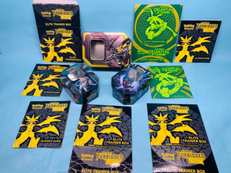 Photo 1 of 278733…empty Pokémon tins, players guides, and empty trainer boxes