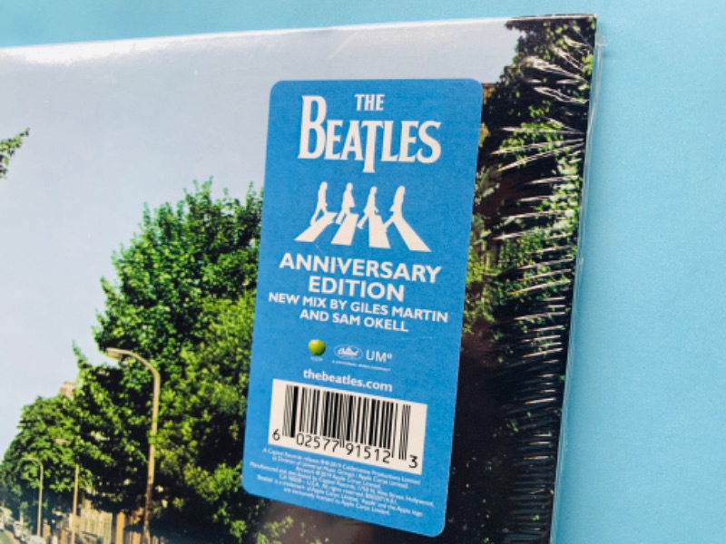 Photo 3 of 278764…sealed Beatles vinyl Abbey Road anniversary edition record in plastic sleeve 
