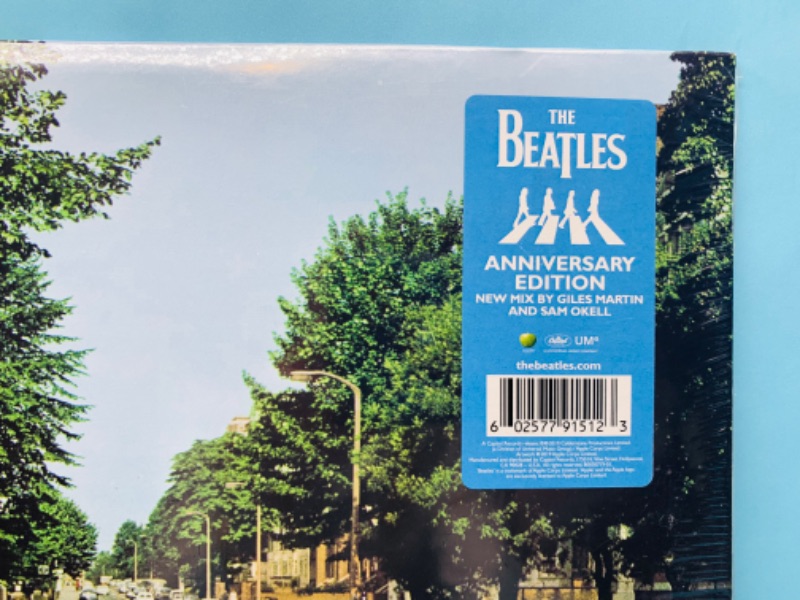 Photo 5 of 278764…sealed Beatles vinyl Abbey Road anniversary edition record in plastic sleeve 