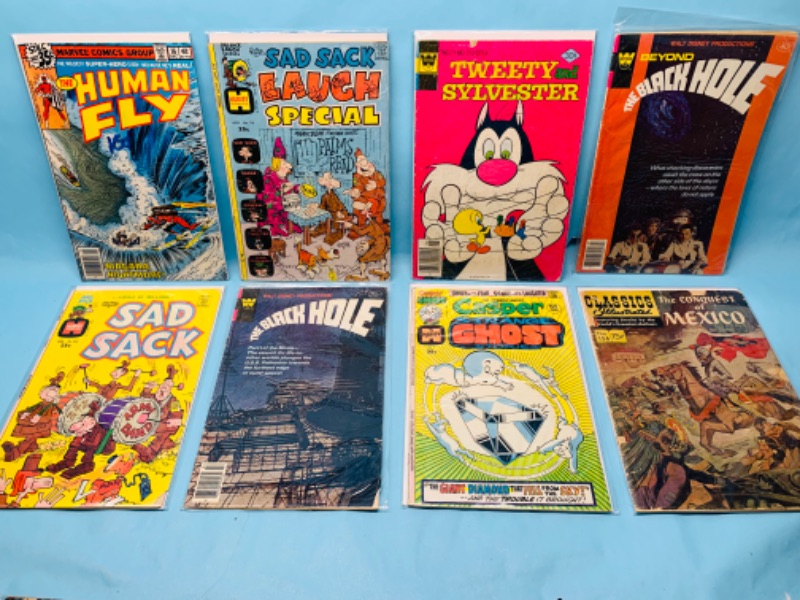 Photo 1 of 278778…8 vintage comics in plastic sleeves- shows some wear from age 