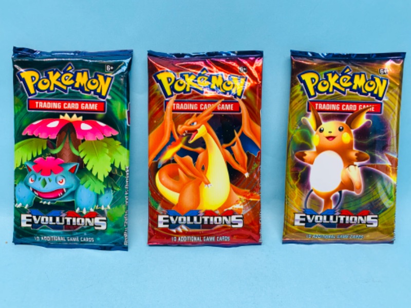 Photo 1 of 278824…3 sealed Pokémon evolutions booster packs 