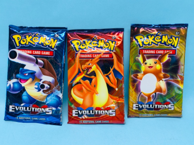 Photo 1 of 278825…3 sealed Pokémon evolutions booster packs 