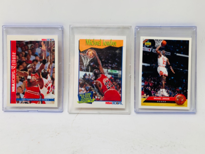 Photo 1 of 278869…3 Michael Jordan trading cards in plastic cases 