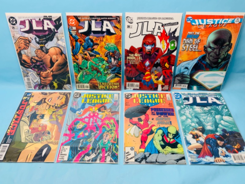 Photo 1 of 279061….8 JLA comics in plastic sleeves 