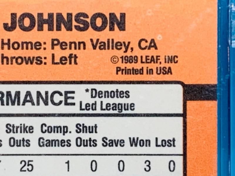 Photo 3 of 279087…donruss error randy Johnson card 379 in hard plastic case - missing dot .