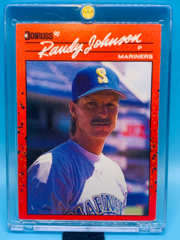 Photo 1 of 279087…donruss error randy Johnson card 379 in hard plastic case - missing dot .