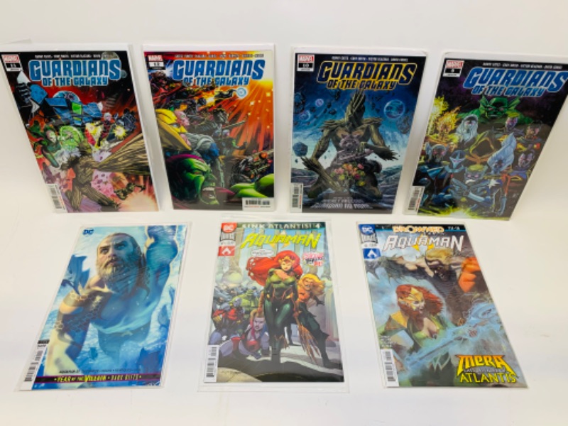 Photo 1 of 279134… guardians of the Galaxy and Aquaman comics in plastic sleeves