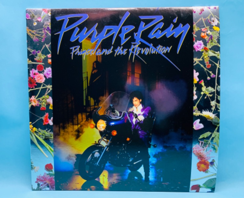 Photo 1 of 279381… great condition Prince Purple Rain vinyl record with poster in plastic sleeve cover and record in great condition 