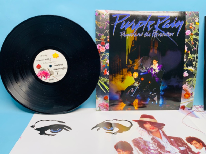 Photo 5 of 279381… great condition Prince Purple Rain vinyl record with poster in plastic sleeve cover and record in great condition 
