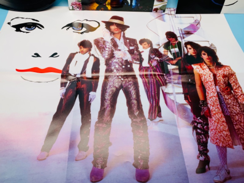 Photo 3 of 279381… great condition Prince Purple Rain vinyl record with poster in plastic sleeve cover and record in great condition 