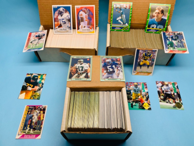 Photo 1 of 279536…mixed football trading cards in boxes 