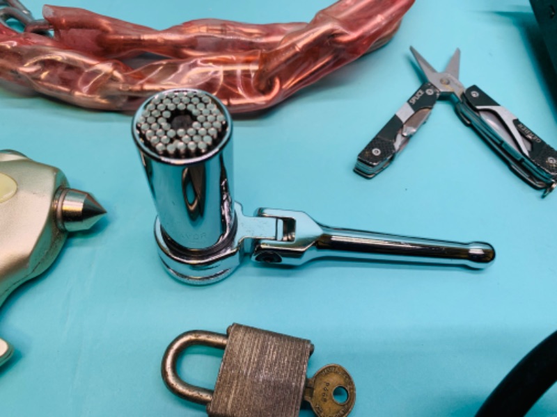 Photo 1 of 279649…misc tools and garage items - gator grip socket, gerber all purpose tool, spring scale and more 