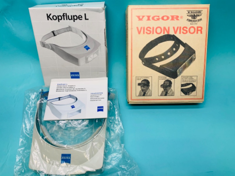 Photo 1 of 279657…2 vision visors with boxes 