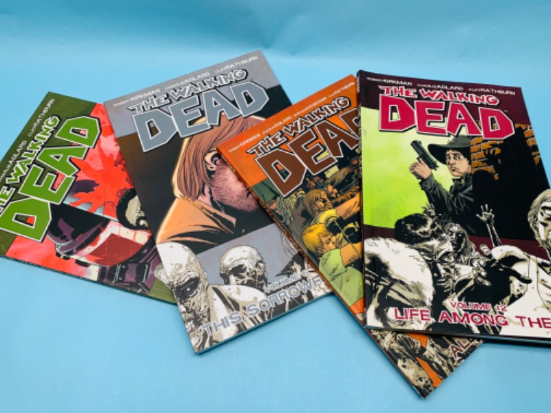 Photo 1 of 279696… 4 walking dead paperback novels