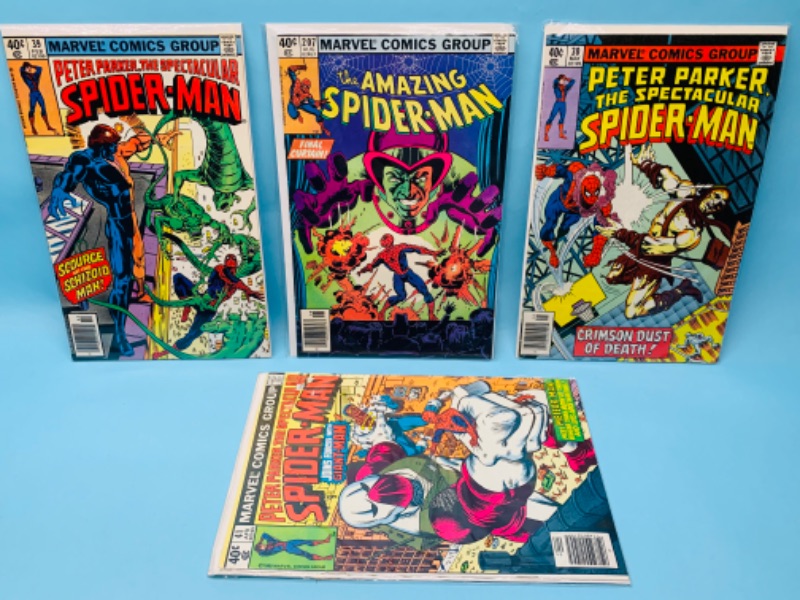 Photo 1 of 279768…4 vintage $.40 cent Spider-Man comics in plastic sleeves 