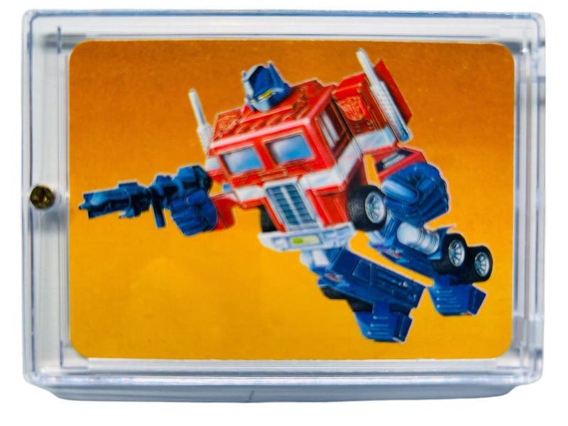 Photo 1 of 279940…vintage 1985 transformers Optimus Prime card 1 series 1  in hard plastic case 