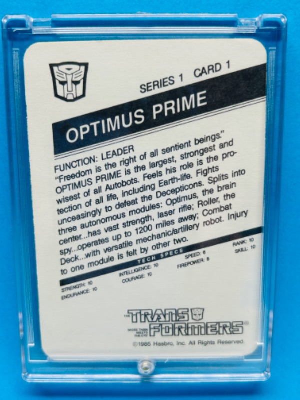 Photo 2 of 279940…vintage 1985 transformers Optimus Prime card 1 series 1  in hard plastic case 