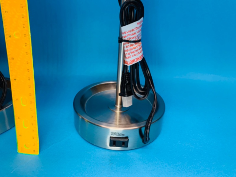 Photo 1 of 282012… …2 stick table lamps with outlet in bases 