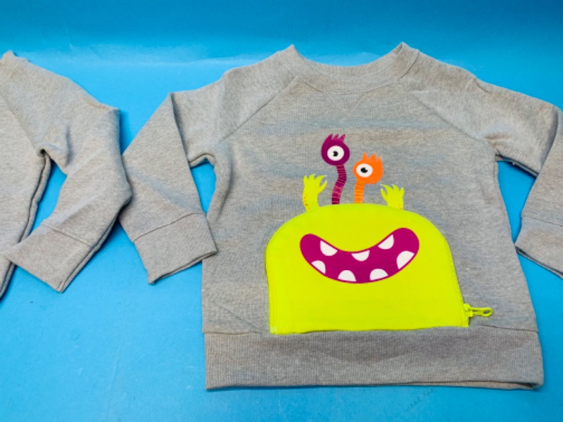 Photo 2 of 282080… …2 sweatshirts size 3T- unzip pocket to expose open mouth 