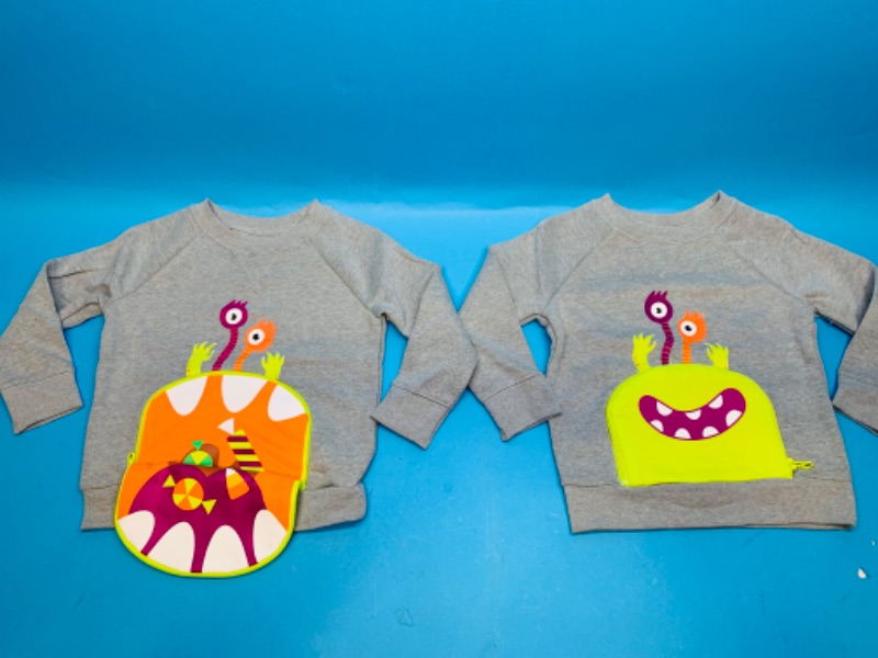 Photo 1 of 282081…2 sweatshirts size 3T- unzip pocket to expose open mouth 