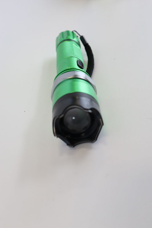 Photo 2 of GREEN AND BLACK TASER FLASHLIGHT COMBO NEW 