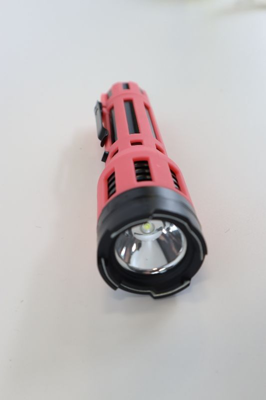 Photo 3 of PINK AND BLACK FLASHLIGHT TASER NEW 