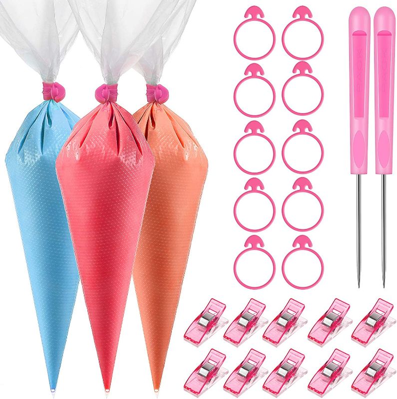 Photo 1 of 122 Pieces Cookie Decoration Tools, 100 Pcs Piping Pastry Bag, 10 Pcs Pastry Bag Ties, 10 Pcs Pastry Bag Clips and 2 Pcs Plastic Awls for Halloween Cookie Cake Decoration (Pink,14 Inch)