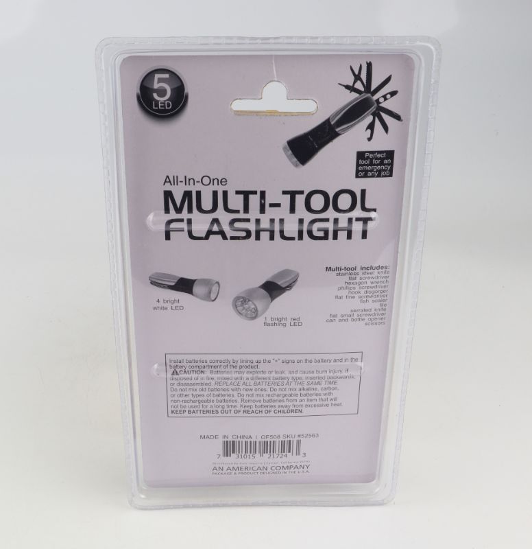 Photo 2 of MULTI TOOL FLASHLIGHT HAS KNIFES SCREWDRIVERS WRENCHES FISH SCALE FIL SCISSORS AND BOTTLE OPENER NEW $ 10