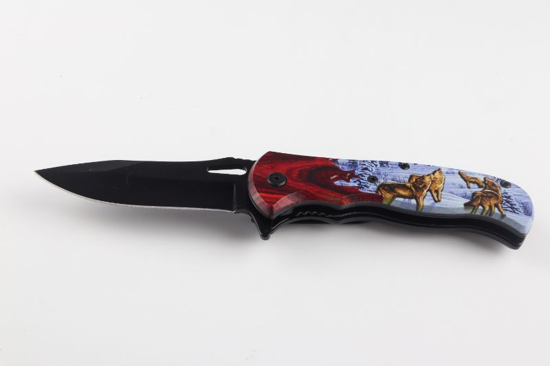 Photo 1 of WOLVES IN SNOW POCKET KNIFE NEW