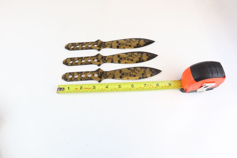 Photo 2 of 3 SET GOLD SKULL THROWING KNIVES 9 AND A HALF INCHES NEW 