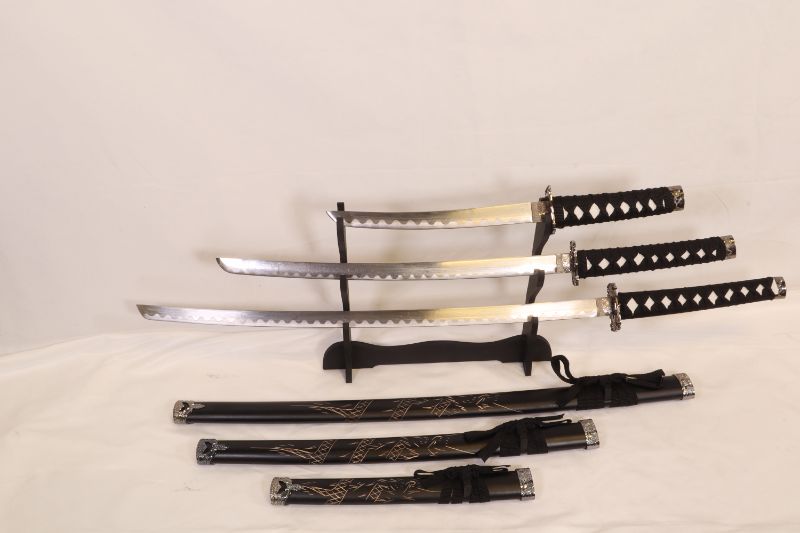 Photo 1 of 3 SET BLACK KATANA SWORDS WITH STAN LARGE 39 1/4 INCH MEDIUM IS 30 INCHES AND SMALL IS 20 INCHES LONG NEW 