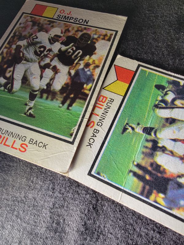 Photo 3 of (2) 1973 OJ SIMPSON CARDS - BOTH CARDS HAVE CREASES AS SEEN IN 3RD PHOTO