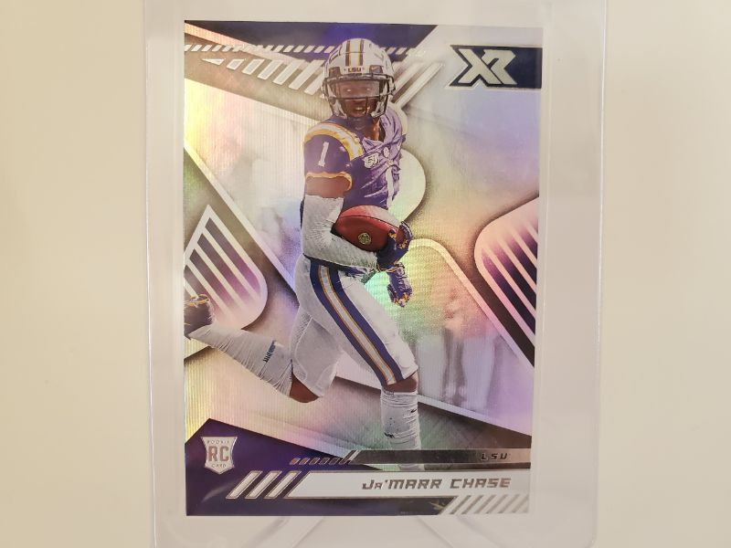 Photo 1 of 2021 PANINI CHRONICLES XR JA'MARR CHASE!!!
WOW IS THIS CARD PERFECT AND HARD TO GET!!
HE IS SET TO BREAK ALL THE ROOKIE RECIEVER RECORDS!!