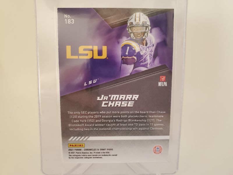 Photo 2 of 2021 PANINI CHRONICLES XR JA'MARR CHASE!!!
WOW IS THIS CARD PERFECT AND HARD TO GET!!
HE IS SET TO BREAK ALL THE ROOKIE RECIEVER RECORDS!!