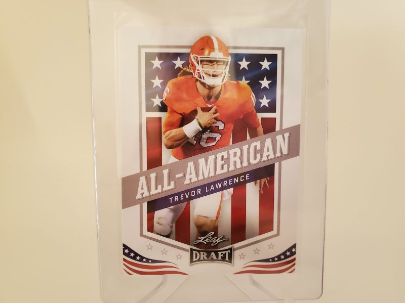 Photo 1 of 2021 LEAF TREVOR LAWRENCE ROOKIE!!
IMMACULATE AND AS NICE AS YOU WILL FIND