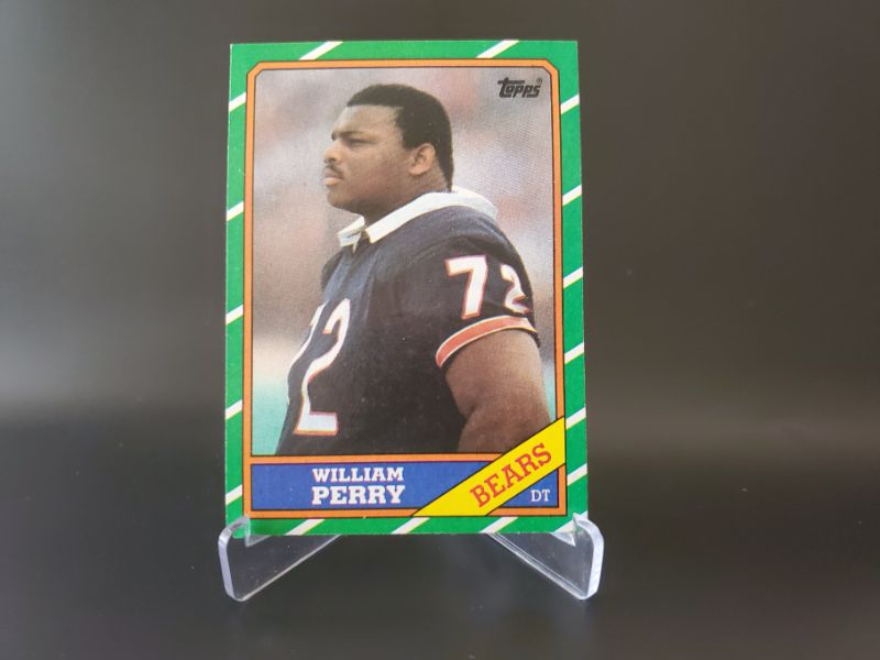 Photo 1 of 1986 TOPPS WILLIAM "THE REFRIDGERATOR" PERRY ROOKIE!!!
THESE CARDS ARE IMPOSSIBLE TO FIND CENTERED AND SHARP!!  HIS ROOKIES GO FOR ALMOST 3K MINT!!
MSRP=$1500
