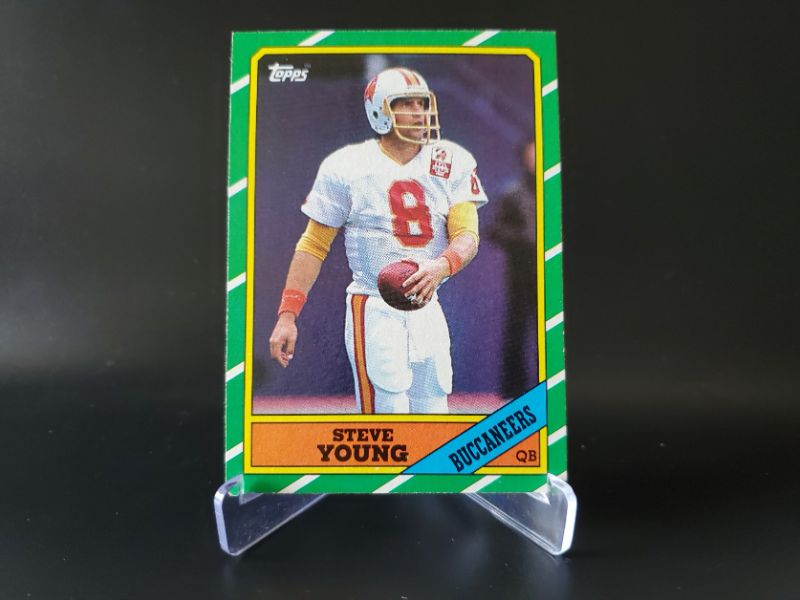 Photo 1 of 1986 TOPPS STEVE YOUNG ROOKIE!! IT'S CENTERED CORNERS ARE SHARP AND WOW IT NEEDS TO GET GRADED NOW!!!
MSRP=$2,000.00