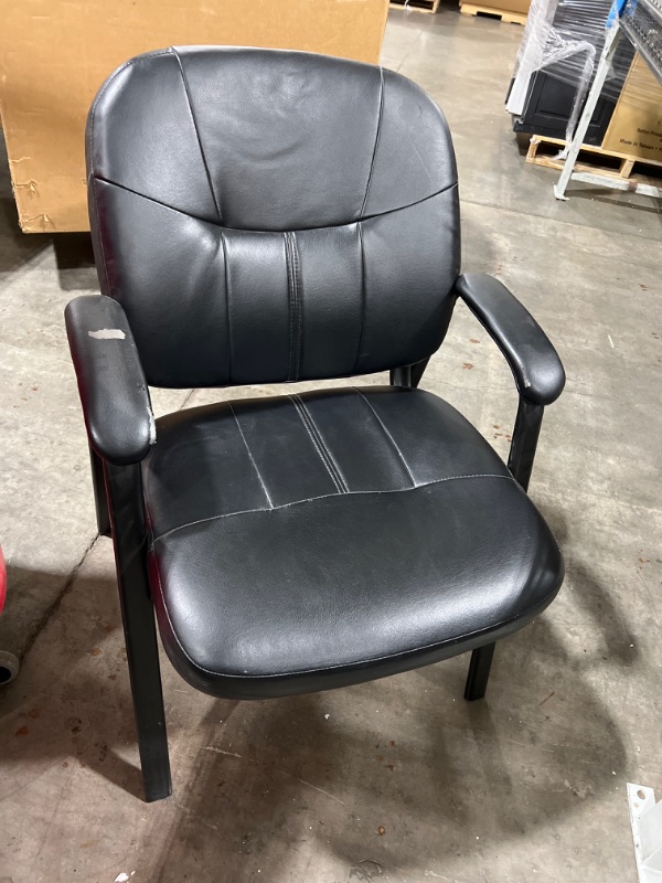 Photo 1 of Black leather chair 