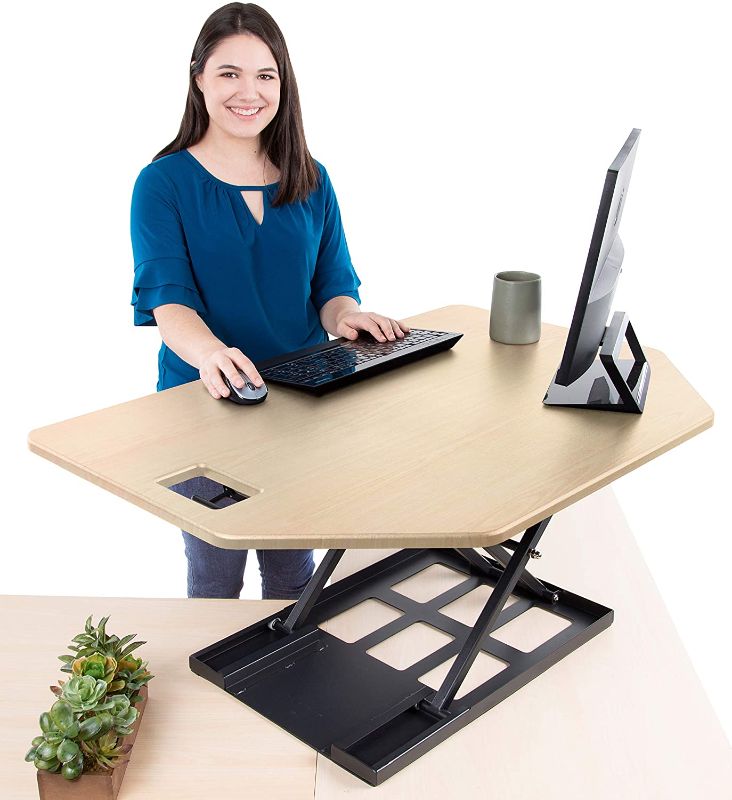 Photo 1 of Stand Steady X-Elite Pro Corner Standing Desk | 40 Inch Corner Sit to Stand Desk Converter Ideal for Cubicles and L Shaped Desks! Easy Height-Adjustable and Fully Assembled! (Maple)
