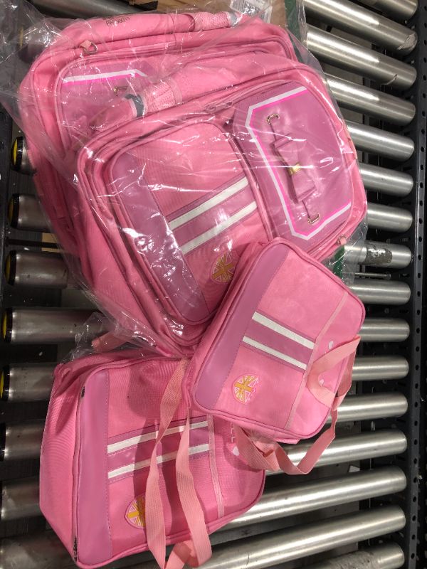 Photo 1 of 2 Trolleys with 2 pink backpacks and lunch boxes  