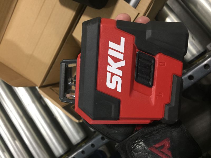 Photo 2 of SKIL 65ft. 360° Red Self-Leveling Cross Line Laser Level with Horizontal and Vertical Lines Rechargeable Lithium Battery with USB Charging Port, Compact Tripod & Carry Bag Included - LL932201