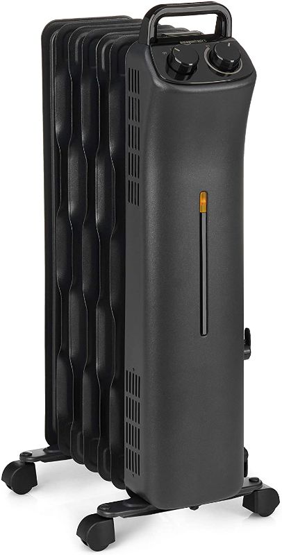 Photo 1 of Amazon Basics Portable Radiator Heater with 7 Wavy Fins, Manual Control, Black, 1500W