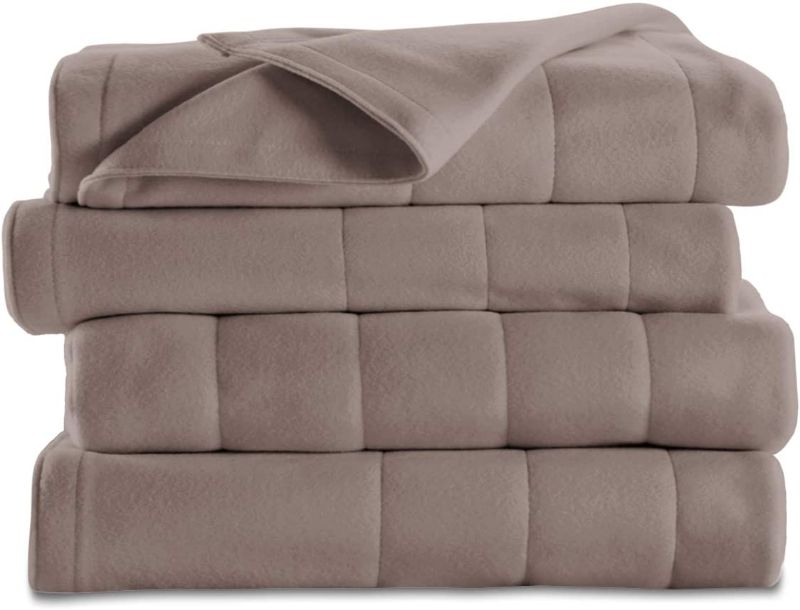 Photo 1 of Cozy up this winter with the added warmth of a Sunbeam Electric Heated Fleece Blanket. This machine-washable, extra-soft fleece blanket features ...
