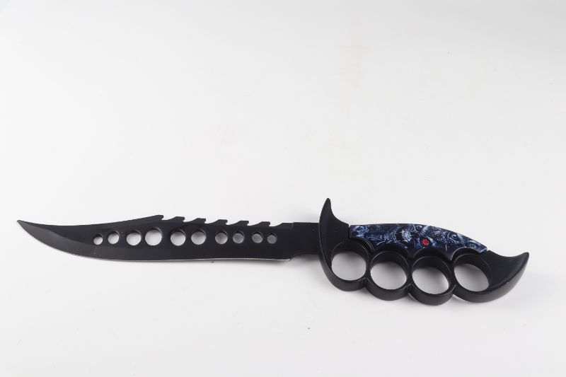 Photo 1 of KNUCKLE GRIP KNIFE WITH SKULL DESGIN  NEW 