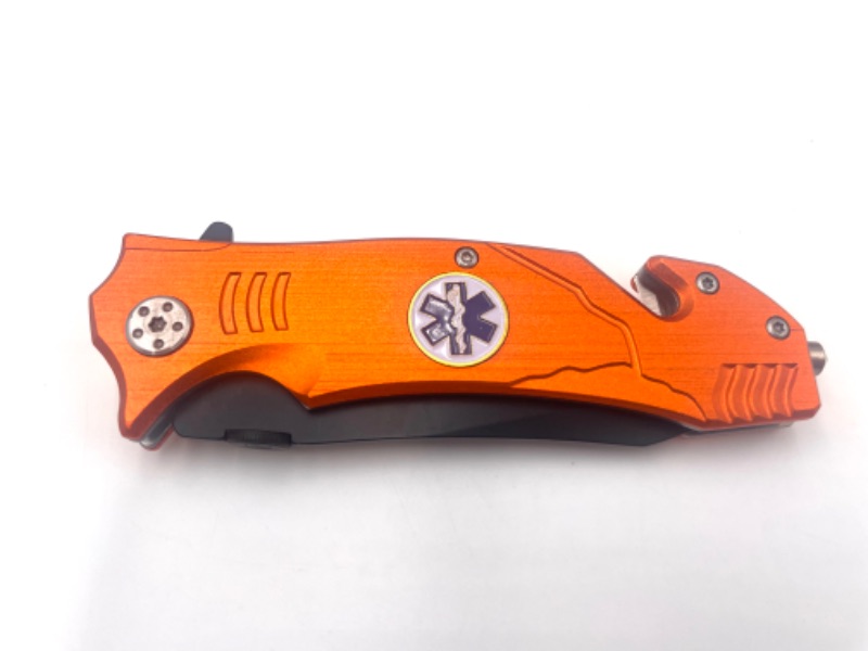 Photo 2 of ORANGE EMS POCKET KNIFE WITH WINDOW BREAKER AND SEATBELT CUTTER NEW 